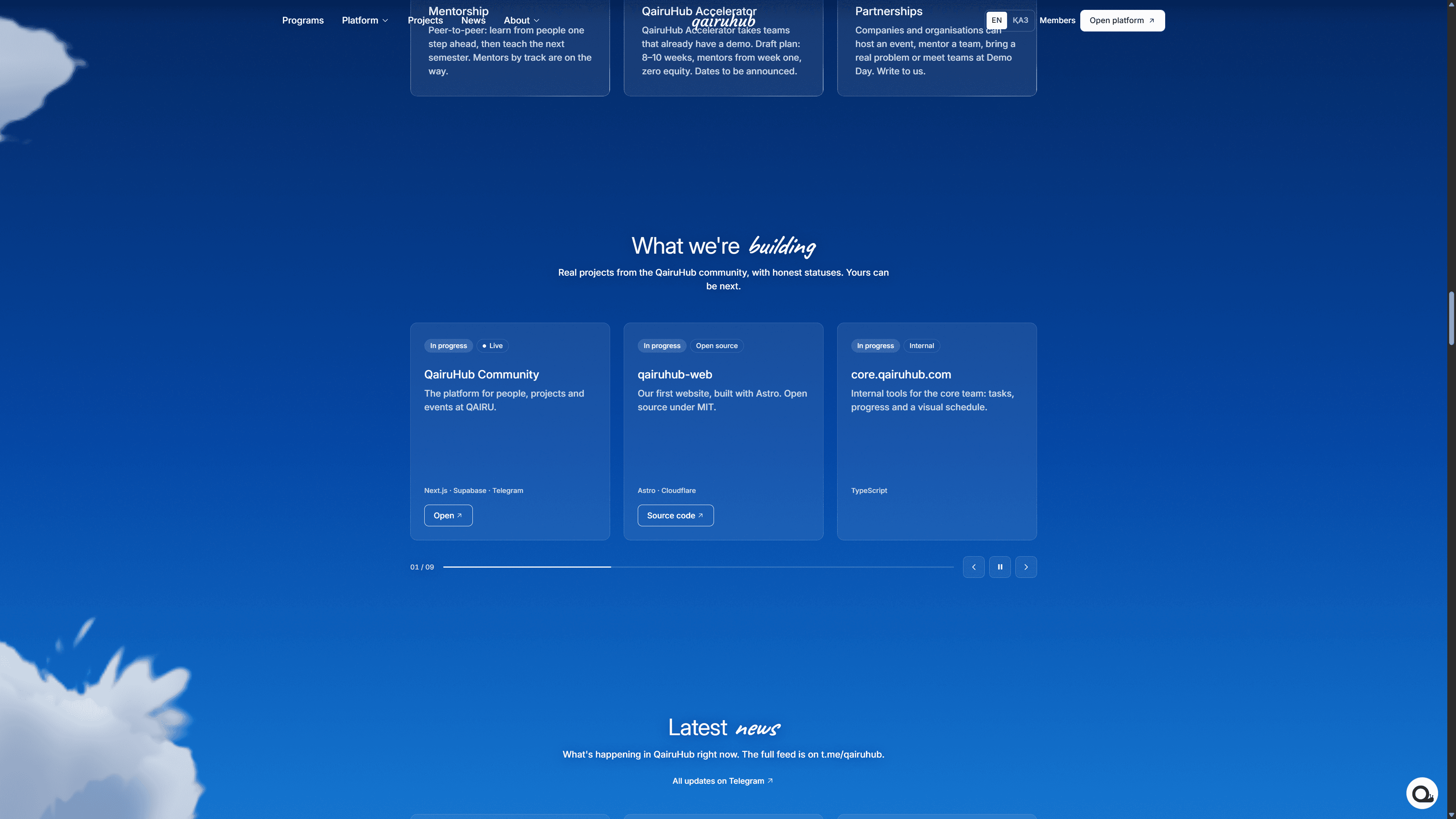 Раздел QairuHub «What we're building» с карточками проектов сообщества и блоком «Latest news» ниже.